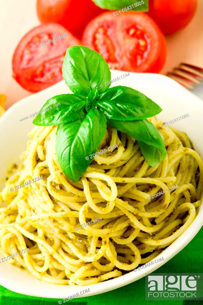 Stock Photo: photo of delicious italian pasta with pesto sauce.