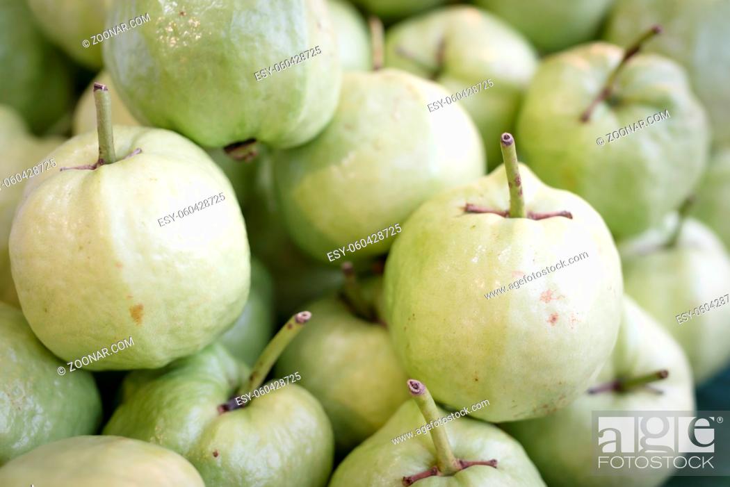 Stock Photo: Guava fresh fruits heap background on open market.