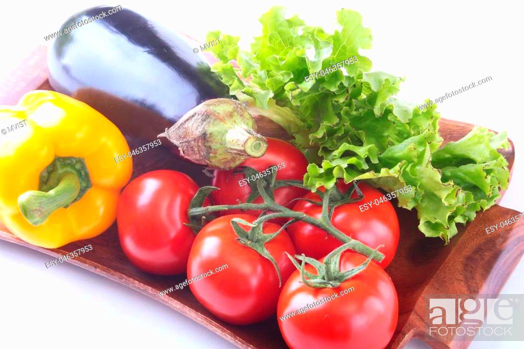 Stock Photo: Fresh assorted vegetables, eggplant, bell pepper, tomato, garlic with leaf lettuce. Isolated on white background. Selective focus.