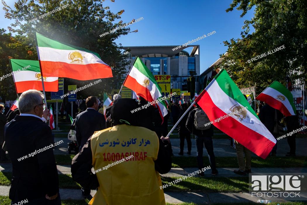 Stock Photo: 09 October 2021, Berlin: Numerous supporters of the National Council of Resistance of Iran demonstrate against the government in Iran in front of the.