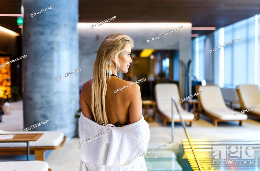 Stock Photo: Beautiful woman relaxing in a beauty spa hotel - Client having a beauty treatment in a beauty spa salon.