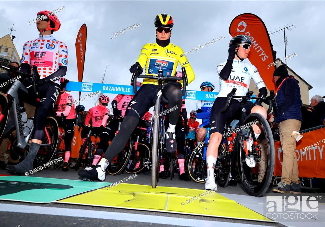 Stock Photo: French Paul Ourselin of TotalEnergies wearing the red polka-dot jersey for best climber, Belgian Tim Merlier of Soudal Quick-Step wearing the yellow leader's.
