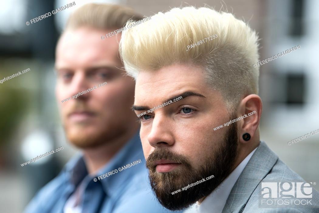 Stock Photo: Models Johann (L) and Nils present new hairstyles at the Top Hair hairdressing exposition press conference in Duesseldorf, Germany, 20 March 2017.