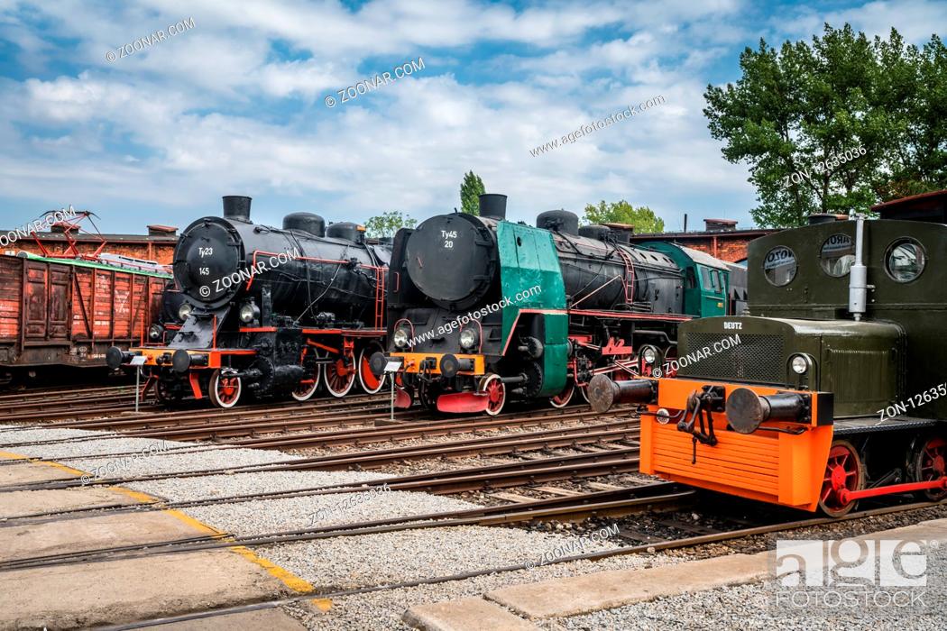 Stock Photo: Jaworzyna Slaska, Poland - August 2018 : Old disused retro train locomotives on the side tracks in the depot in the Museum of Industry and Railway in Silesia.