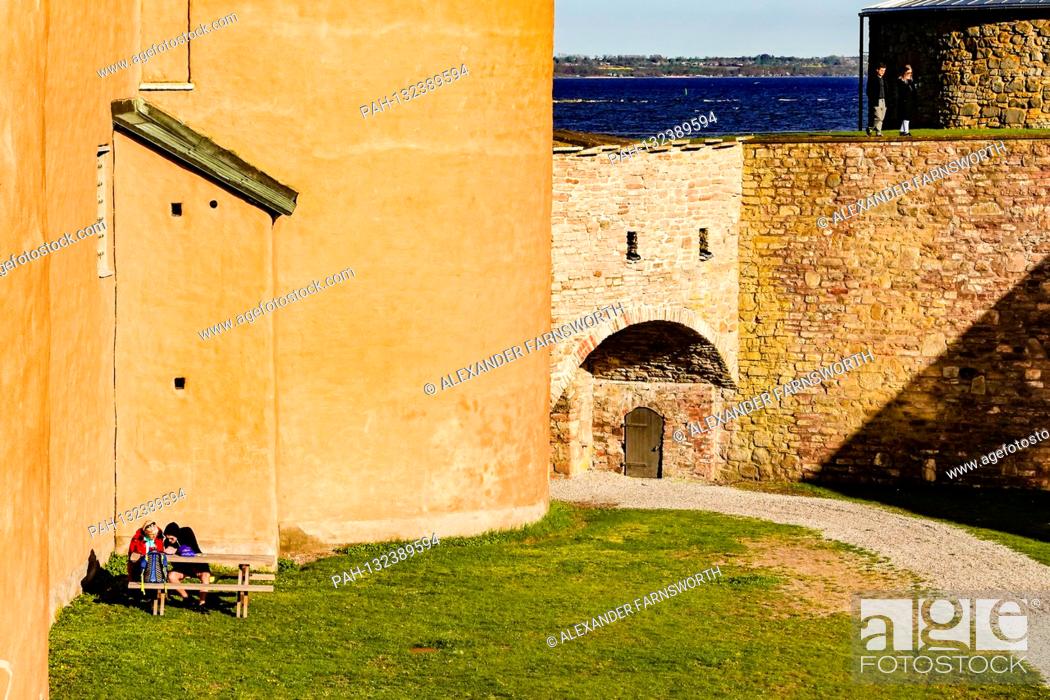 Stock Photo: Kalmar, Sweden People having a summer picnic on the grounds of the Kalmar Castle. | usage worldwide. - KALMAR/Sweden.