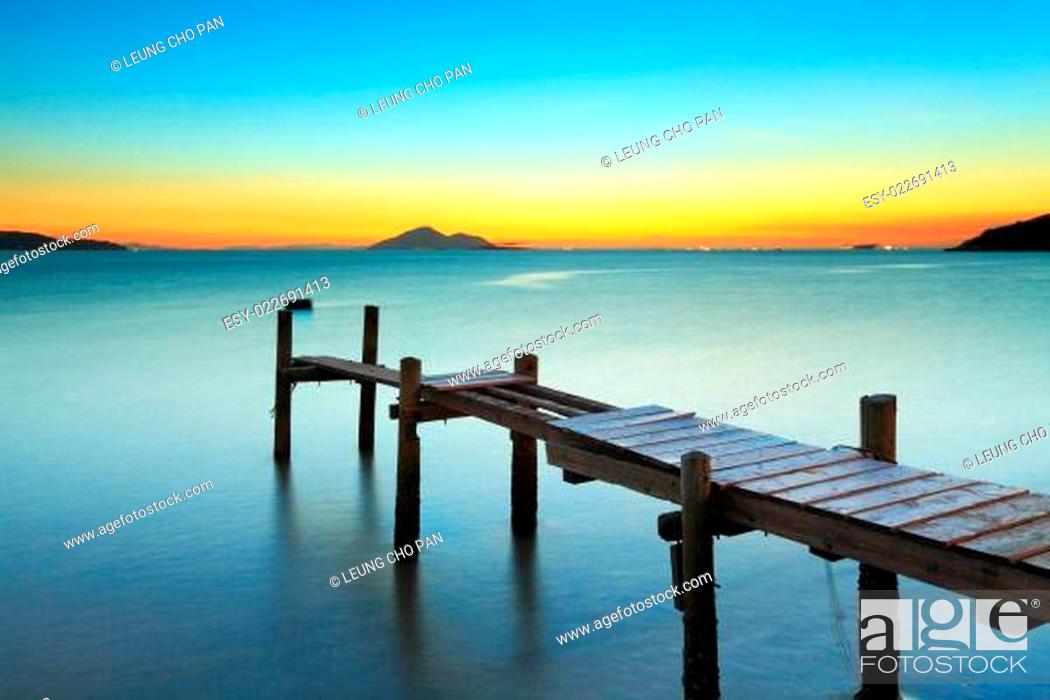 Stock Photo: Wooden pier and sunset.