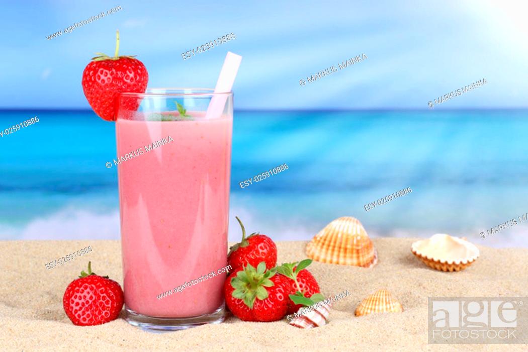 Stock Photo: strawberry smoothie juice with strawberry fruit juice on the beach on vacation.