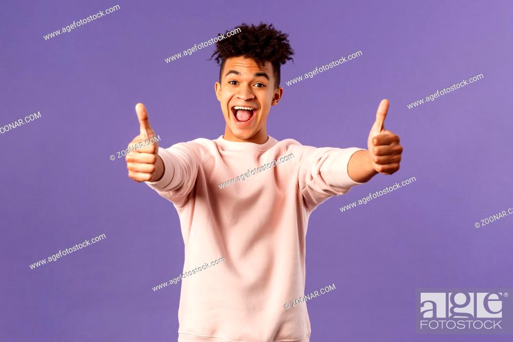 Stock Photo: Portrait of satisfied young happy man think event was super cool, recommend use company service, assure in best quality, like and approve awesome product.