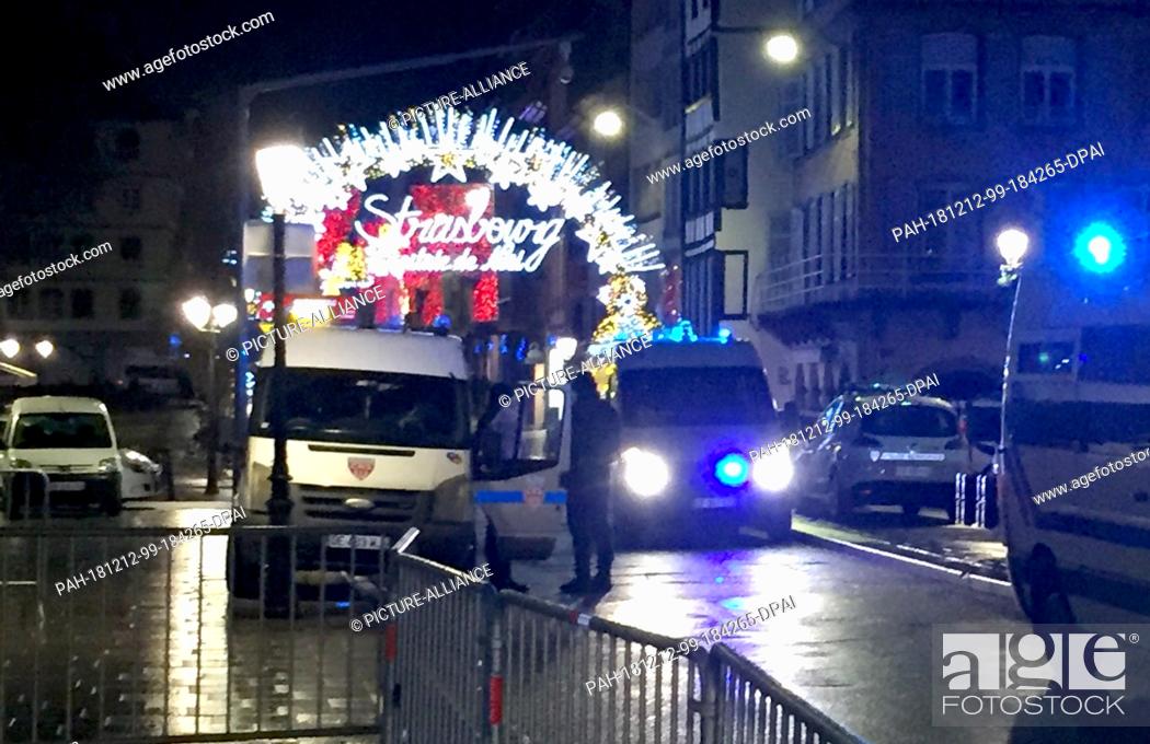 Stock Photo: 11 December 2018, France (France), Straßburg: The entrance to the Christmas market at the Pont du Corbeau is cordoned off by the police.