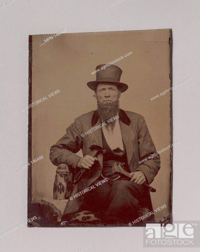 Stock Photo: [Man in Top Hat Holding a Hammer and Wrench]. Artist: Unknown (American); Date: 1860s- early 70s; Medium: Tintype; Dimensions: Image: 8.
