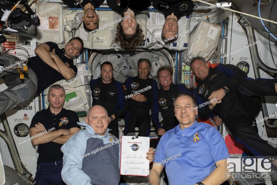 Stock Photo: The 11-person crew photographed aboard the International Space Station (ISS) on April 9, 2022, comprises of (clockwise from bottom right) Expedition 67.