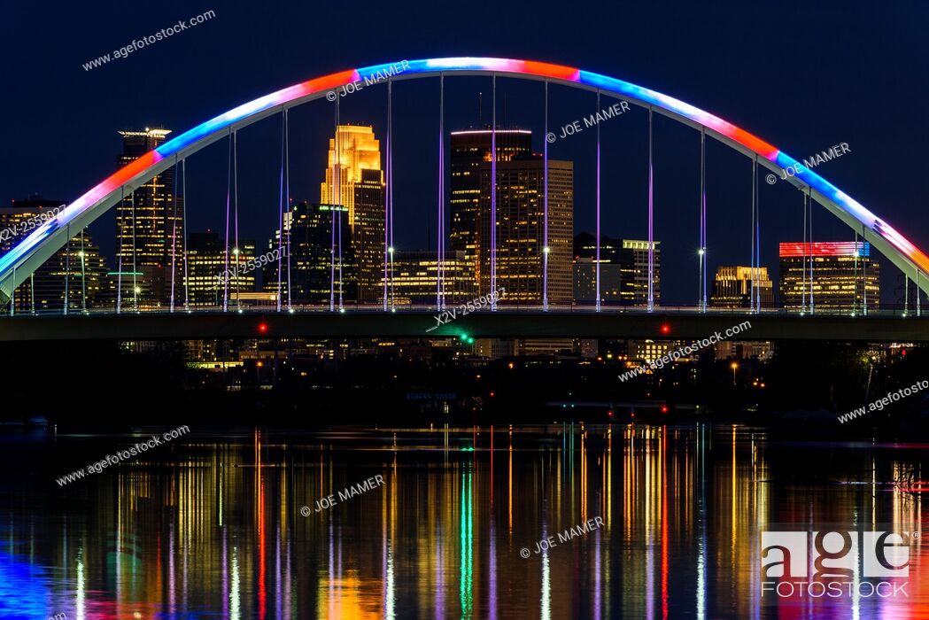 Stock Photo: Lowry Avenue bridge at dusk with blue and red lighting.