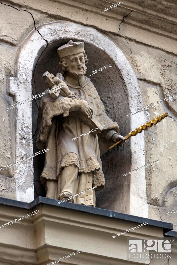 Stock Photo: Sculptureof Saint Nepomuk in a niche of a town house, Bamberg, Upper Franconia, Bavaria, Germany.