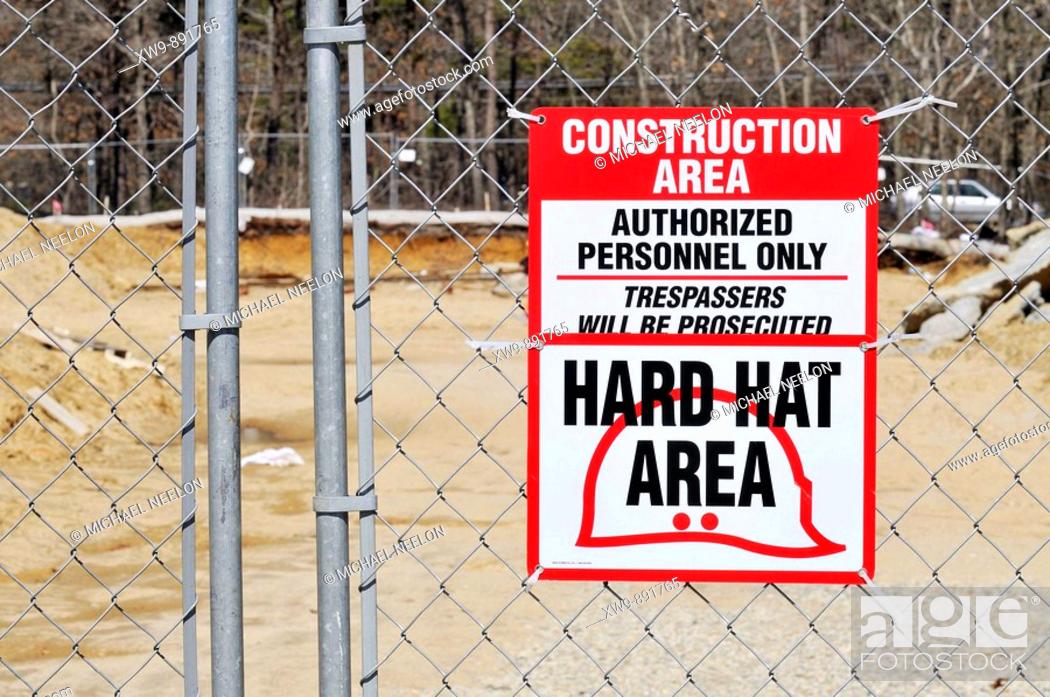Stock Photo: Construction site warning sign hard hat area, authorized personnel only, trespassers will be prosecuted.