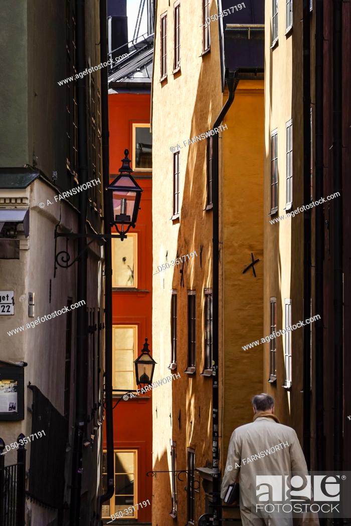 Stock Photo: Stockholm, Sweden A man walking in the Old Town or Gamla Stan.