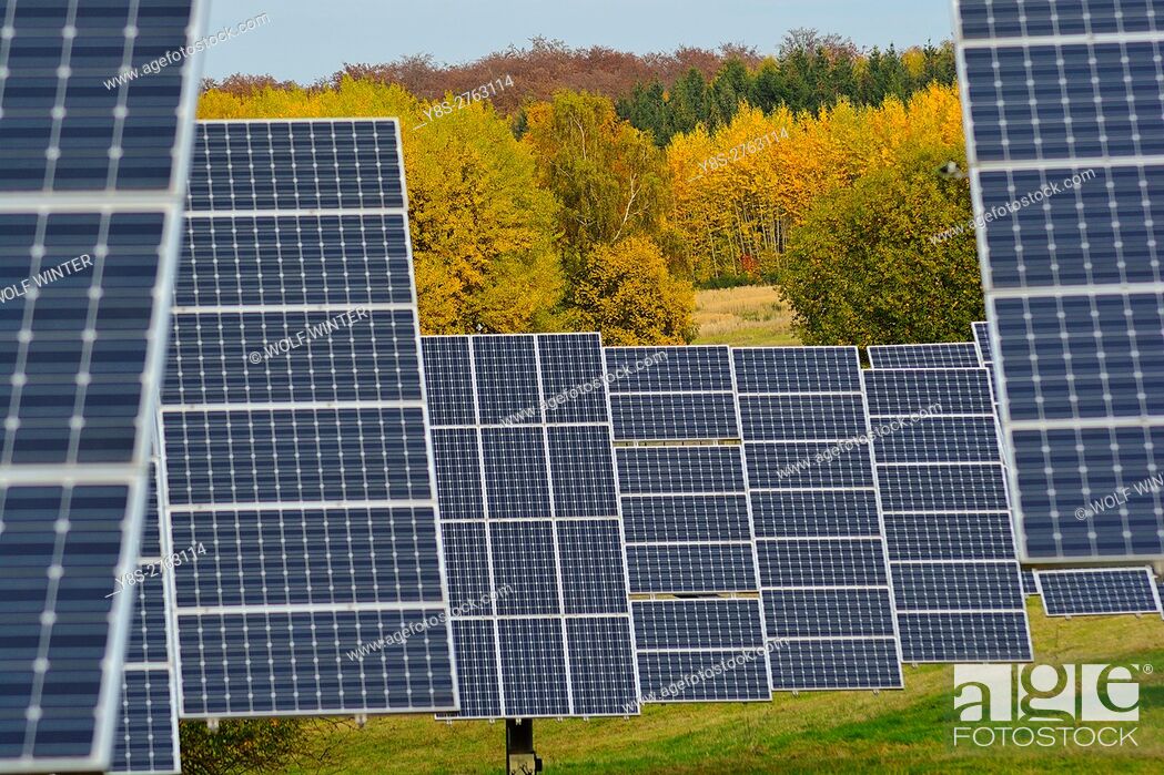 Stock Photo: Solarpark Mengeringhausen with static Modules and Modules, that follow the Azimuth of the Sun. They produce electricity in any position and angle.