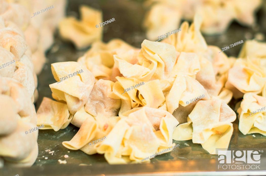 Stock Photo: making of wanton or wantan, a chinese dumplings. Photo is taken at Hubu lane snack street in Wuhan, China.