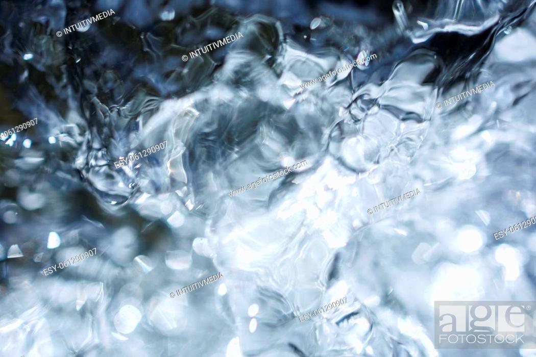 Stock Photo: Flowing water with air bubbles.