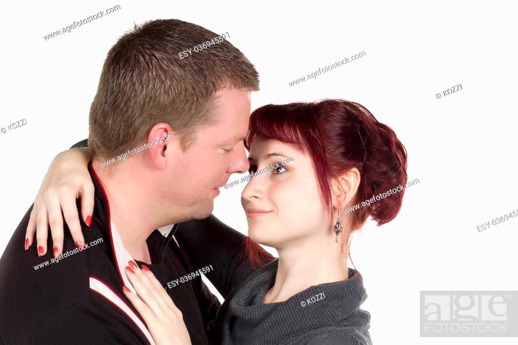 Stock Photo: Stock photo of Handsome man and beautiful woman embracing and about to kiss.