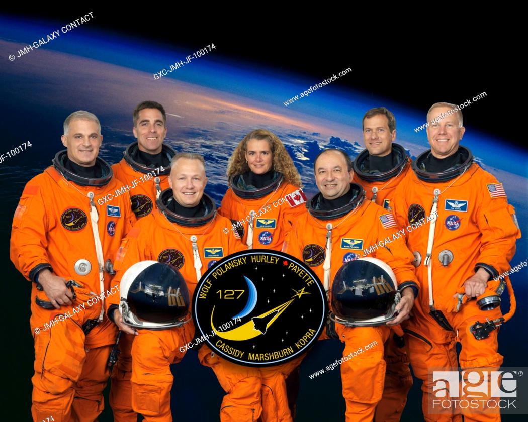 Stock Photo: Attired in training versions of their shuttle launch and entry suits, these seven astronauts take a break from training to pose for the STS-127 crew portrait.