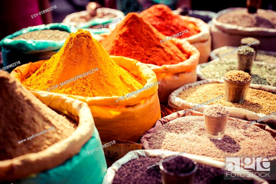 Stock Photo: Indian colored spices at local market.