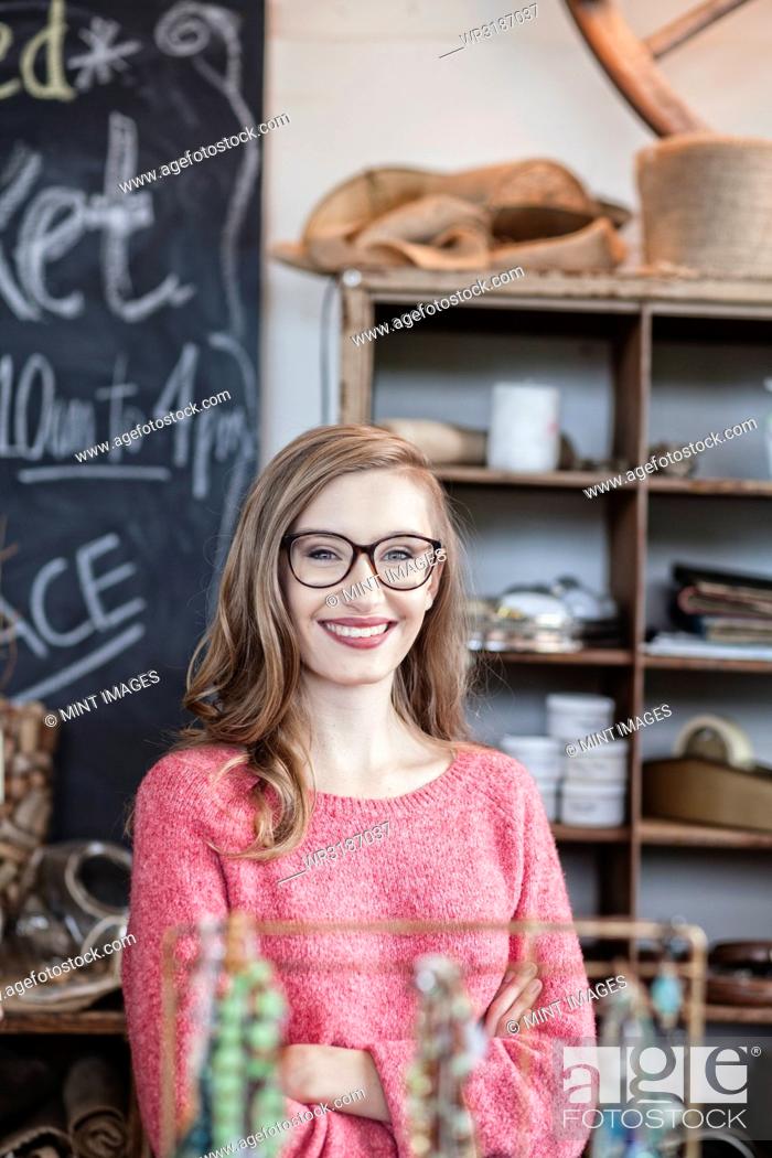 Stock Photo: Caucasian woman working at an antique store.