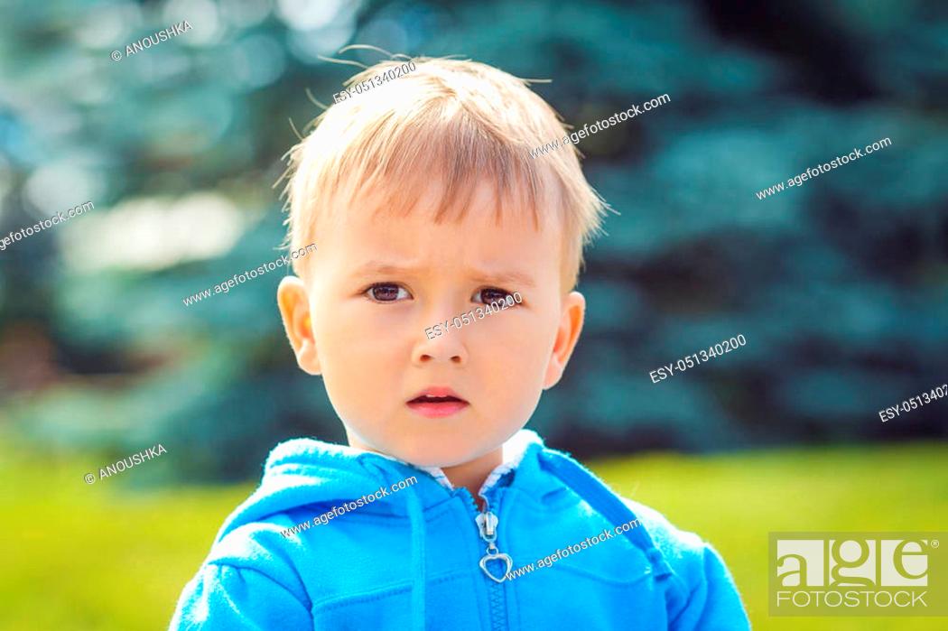 Closeup portrait of cute young Caucasian little boy with blond hair and dark  brown eyes with funny..., Stock Photo, Picture And Low Budget Royalty Free  Image. Pic. ESY-051340200 | agefotostock