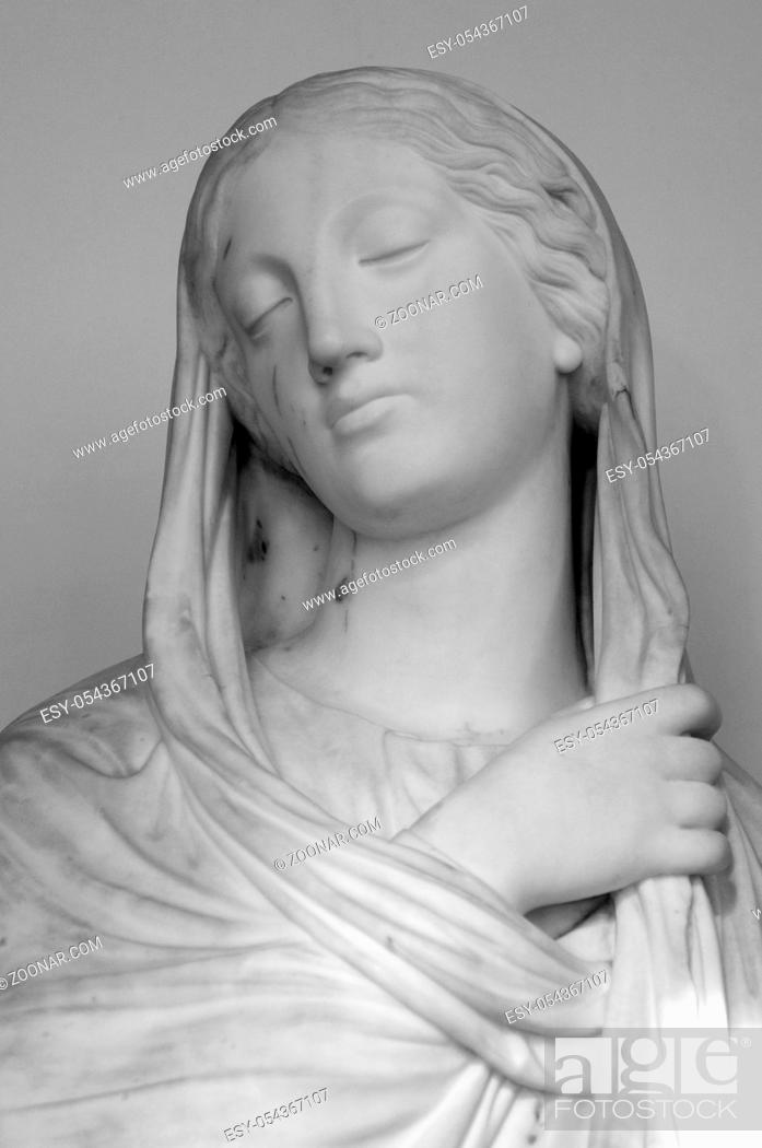 Stock Photo: White marble head of young woman. Statue of a woman in the antique style. Ancient sculpture of lady face.