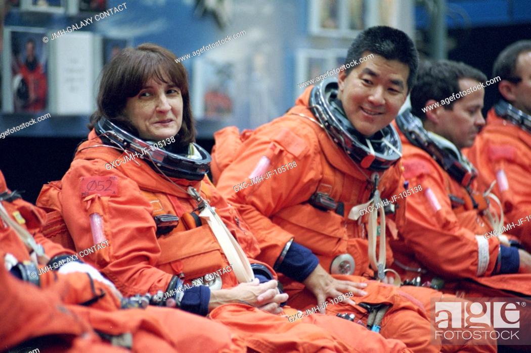 Stock Photo: Astronauts Linda M. Godwin (left) and Daniel M. Tani, both STS-108 mission specialists, and Daniel W. Bursch and Carl E. Walz.