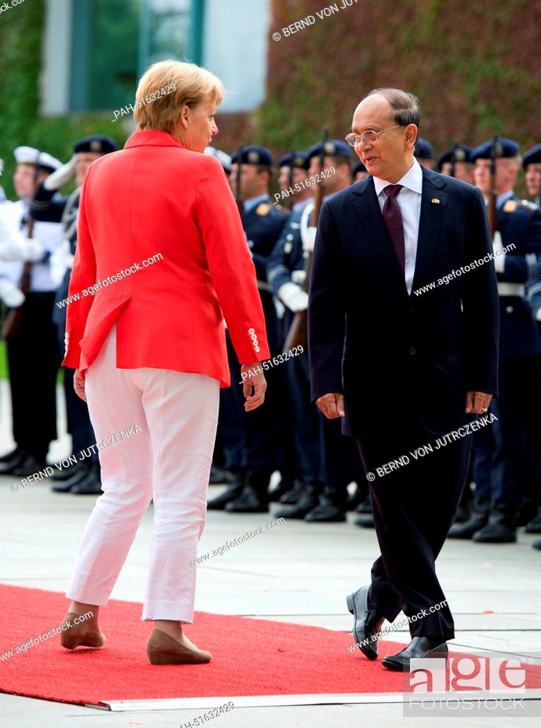 Stock Photo: German Chancellor Angela Merkel welcomes Burmese President Thein Sein with military honours at the Federal Chancellery in Berlin, Germany, 03 September 2014.