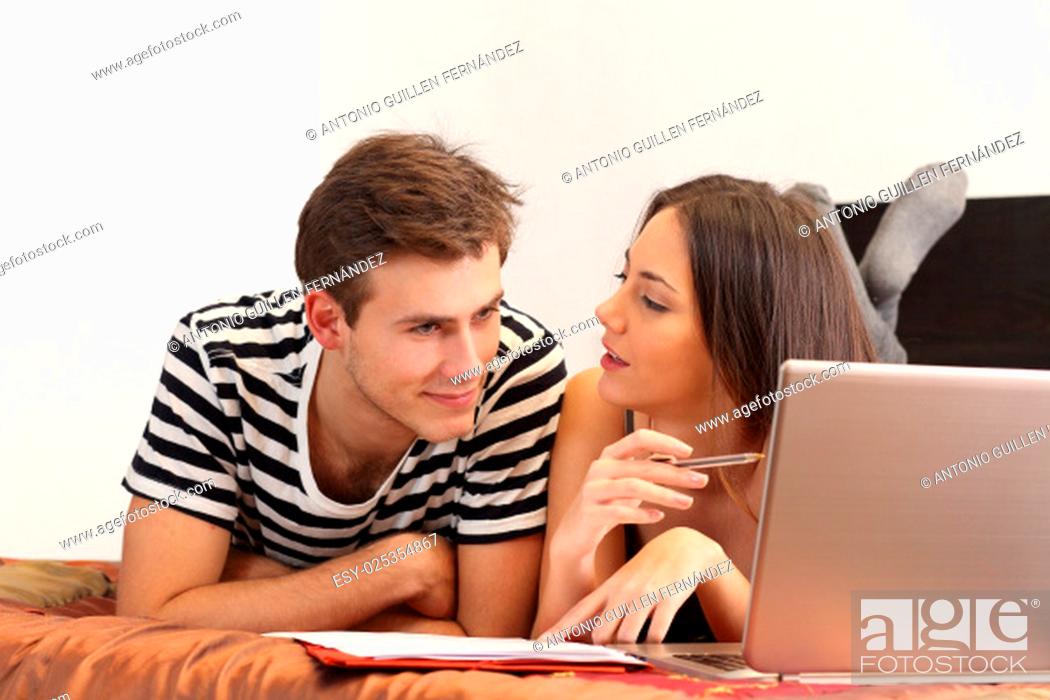 Stock Photo: Students studying and learning at home with a laptop and notes.