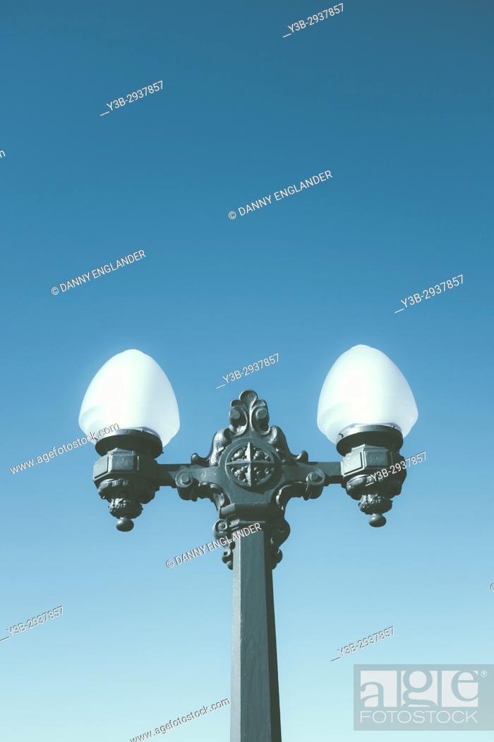 Stock Photo: Historic, vintage lamp post with a turquoise sky in the background in San Diego, CA.
