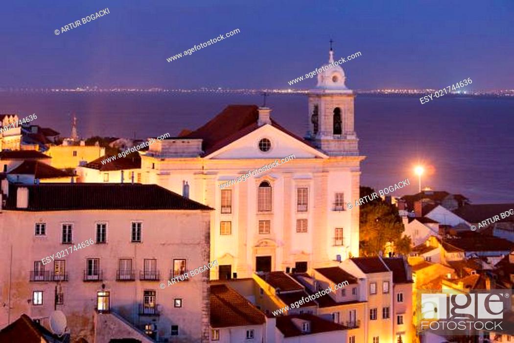Photo de stock: Santo Estevao Church at night in old Alfama district of Lisbon in Portugal, Tagus river in the background.