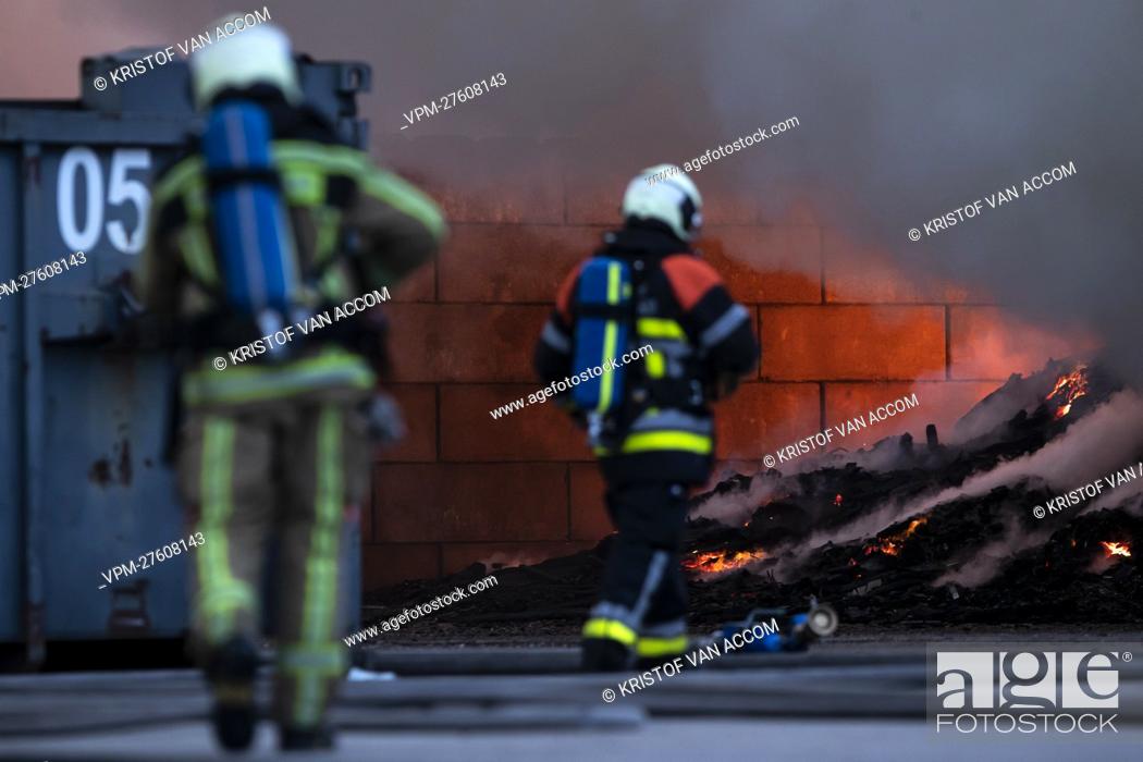 Stock Photo: Fire fighters pictured at the site of IOK recycling and waste management company, in Beerse, Monday 28 March 2022. BELGA PHOTO KRISTOF VAN ACCOM.