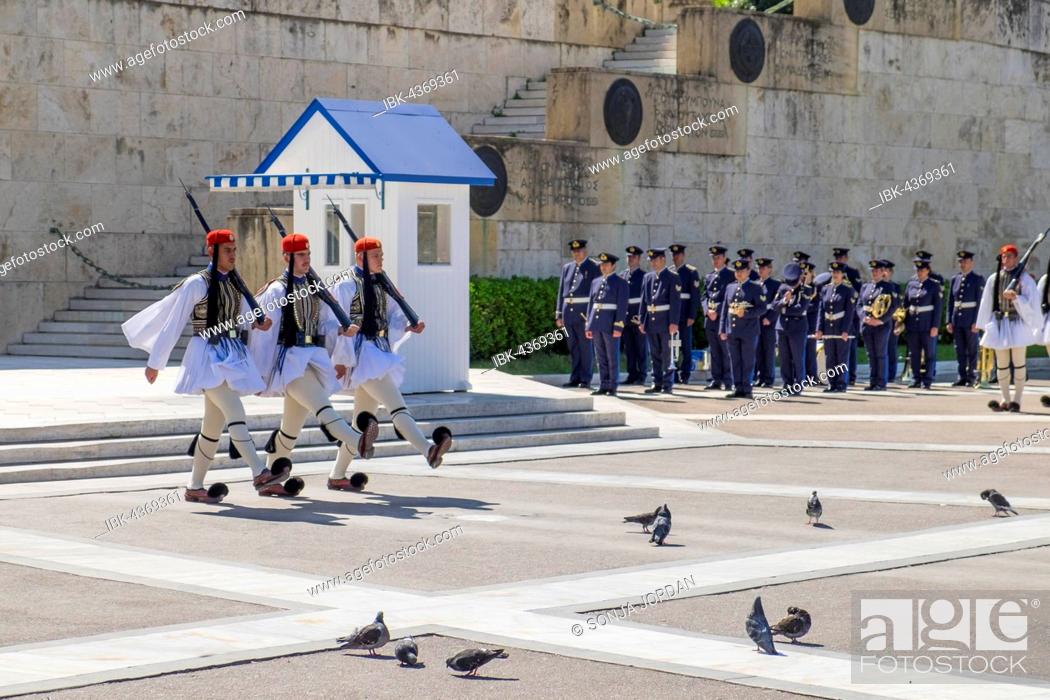 Stock Photo: Changing of the guards in front of Parliament, Evzones at the Tomb of the Unknown Soldier on Syntagma Square in Athens, Greece.