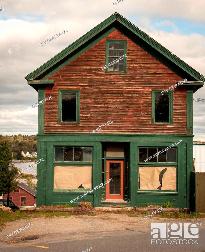 Stock Photo: Old wooden abandon store in rural maine.