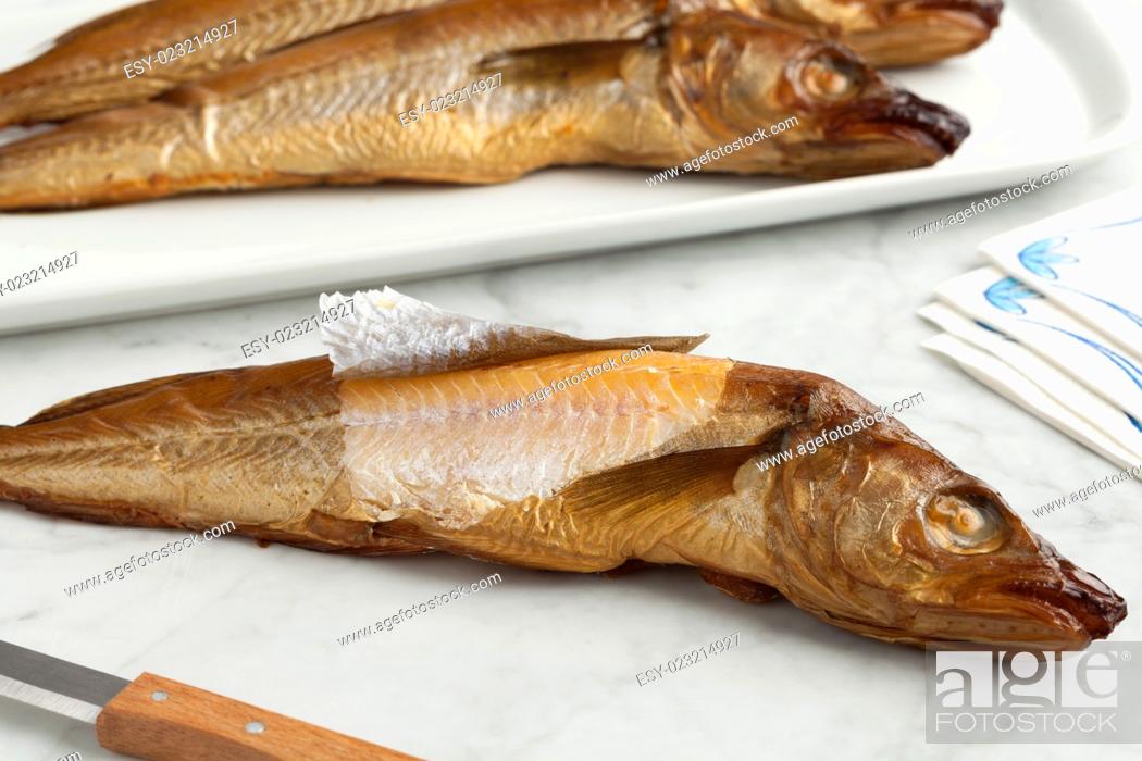 Stock Photo: Fresh smoked whiting fish on white background.