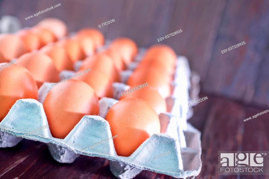 Stock Photo: raw brown eeg, chicken eggs on a table.