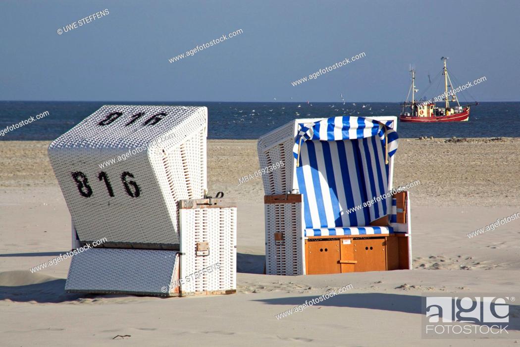 Stock Photo: Morning hour with shrimp boat and beach chairs on the beach of Ording,.