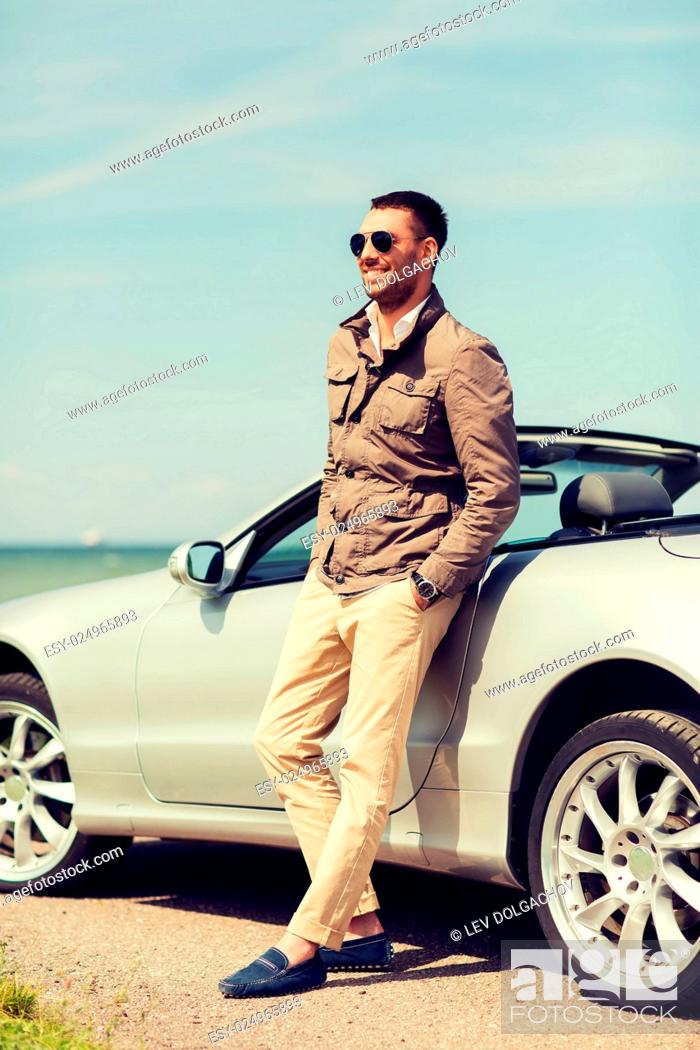 Stock Photo: auto business, transport, leisure and people concept - happy man near cabriolet car outdoors.