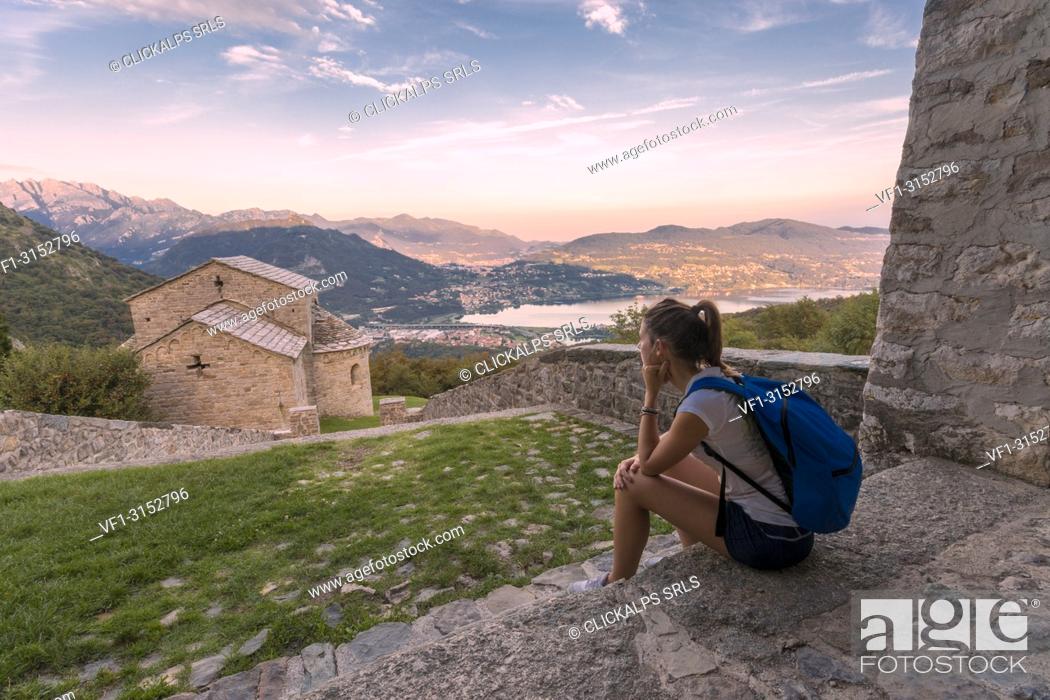 Stock Photo: Woman sightseeing at the abbey of San Pietro al Monte, an ancient monastic complex of Romanesque style in the town of Civate, Lecco province, Lombardy, italy.