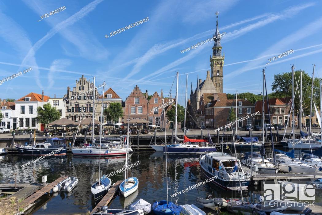 Stock Photo: Cityscape at the marina with historic town hall, Veere, Zeeland, Netherlands, Europe | Cityscape at the marina of Veere with historic town hall.