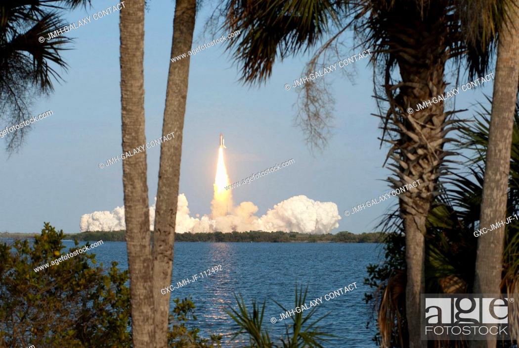 Stock Photo: Space shuttle Discovery and its six-member STS-133 crew head toward Earth orbit and rendezvous with the International Space Station.