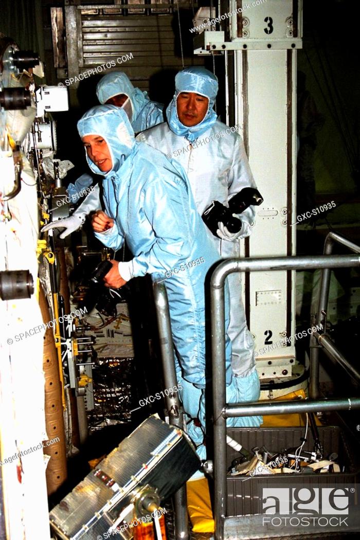 Stock Photo: 10/02/1997 --- Participating in the Crew Equipment Integration Test CEIT at Kennedy Space Center are STS-87 crew members, assisted by Glenda Laws.