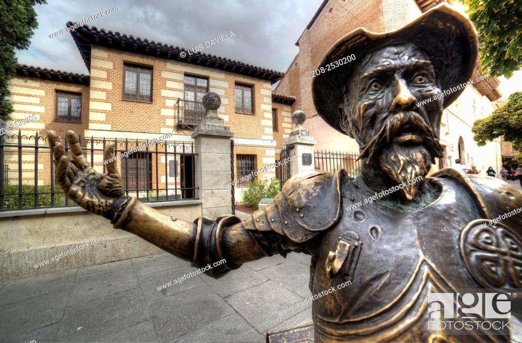 Stock Photo: El quijote statue in front of Cervantes birth house-museum. alcala de henares. Spain. It is a monographic museum placed in Calle Mayor.