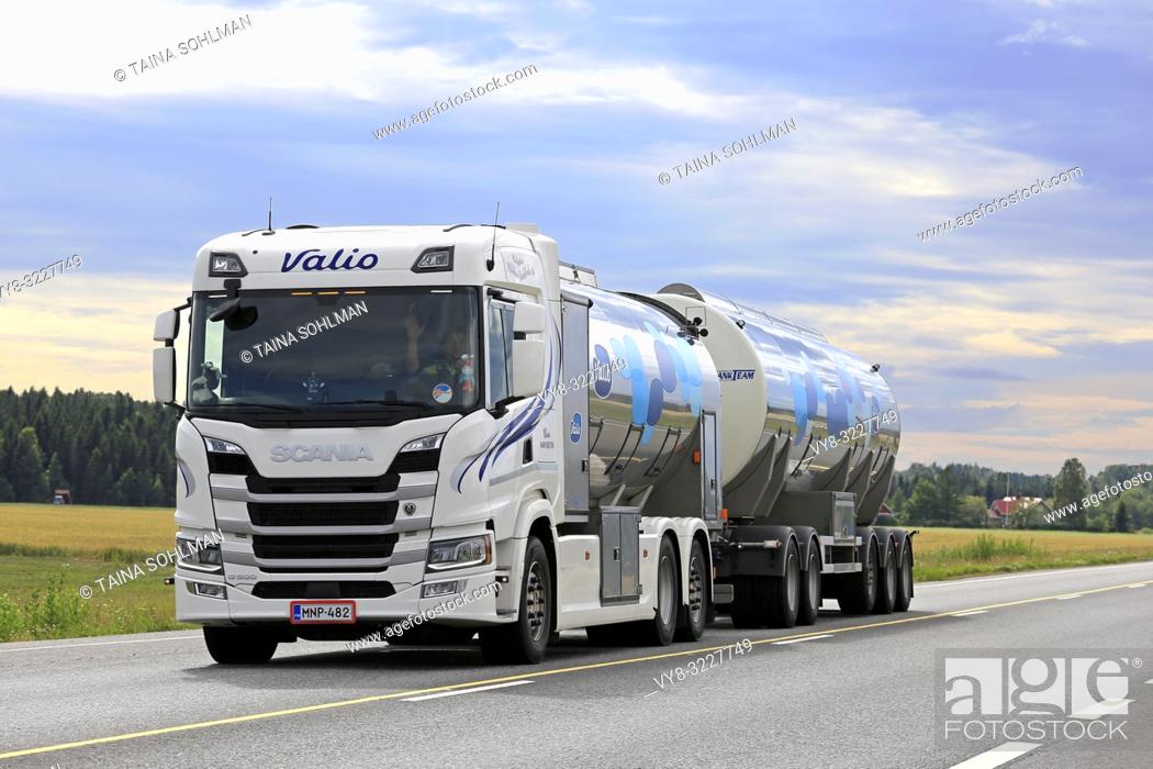 Stock Photo: Koski Tl, Finland - August 4, 2018: White Next Generation Scania G500 milk tank truck transports Valio milk along highway 10 on a summer afternoon.