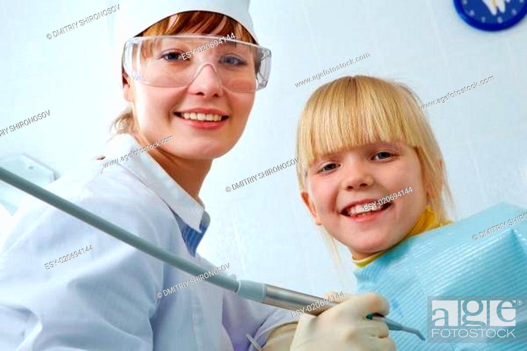 Stock Photo: Dentist and girl.