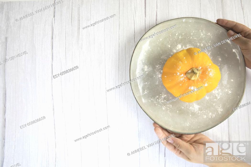 Stock Photo: Orange pumpkin on white wooden background with copy space on natural plate top view, autumn harvest, Halloween or Thanksgiving concept space for text.