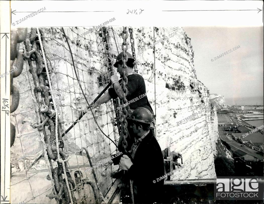 Stock Photo: Sep. 09, 1968 - Strengthening the white cliffs.: With a fine view of Dover Harbor in the background, Mr. Dennis Smith, 29, of Dover and Mr.