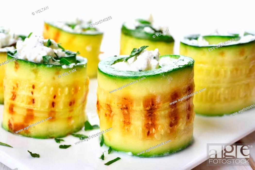 Stock Photo: Appetizer grilled zucchini rolls with curd cheese.